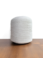 Load image into Gallery viewer, Ishikawa Safari Washi Blend Cone Yarn showcasing a soft white color in a cone shape on a wooden surface.