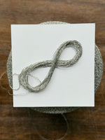 Load image into Gallery viewer, CTF Lustro Metallic Carry-Along Cone Yarn · 1/11,700nm · Warm Silver
