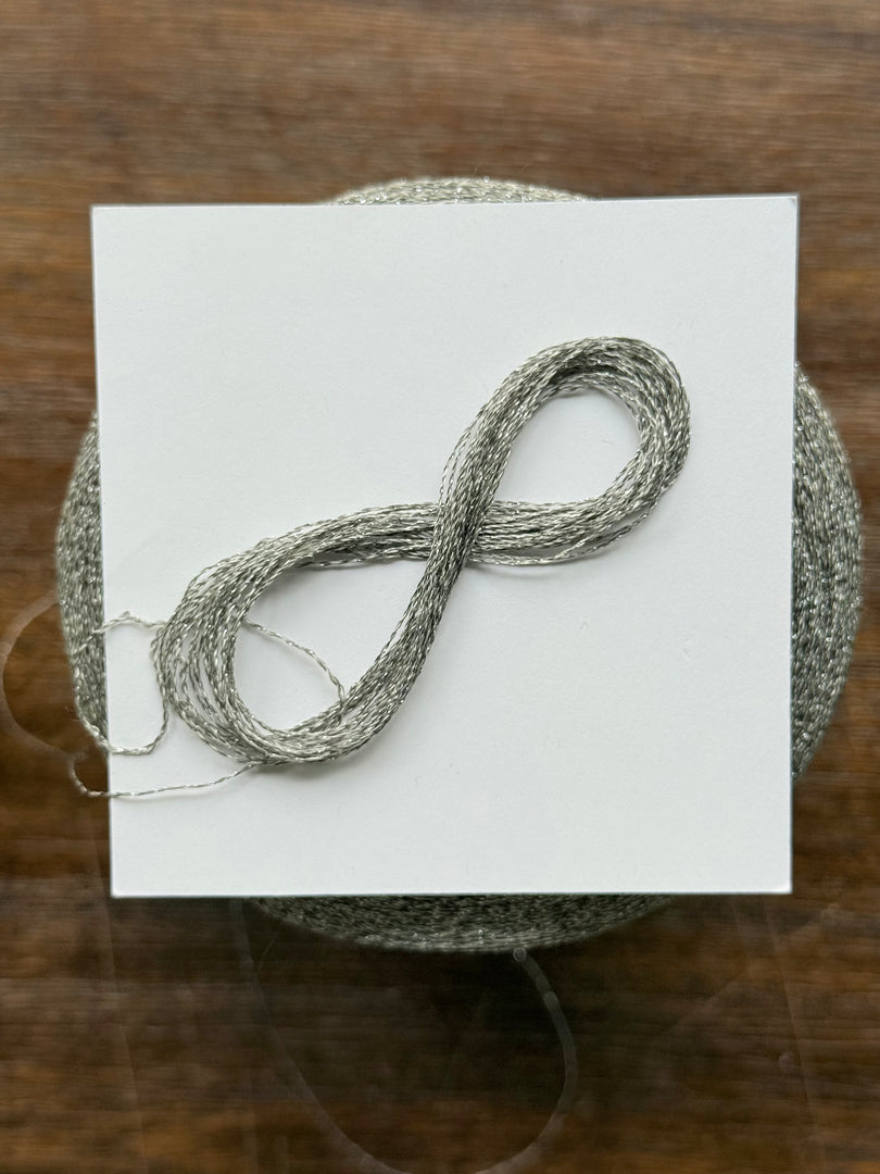 CTF Lustro Metallic Carry-Along Cone Yarn · 1/11,700nm · Warm Silver