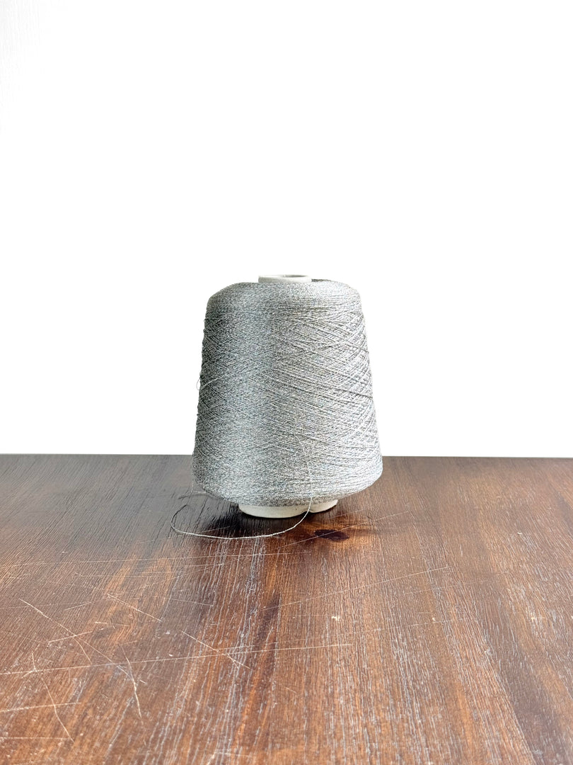 CTF Lustro Metallic Carry-Along Cone Yarn · 1/11,700nm · Warm Silver