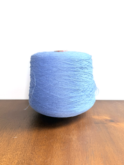 100 linen Cone Yarn in light blue color, showcasing the texture and structure of the yarn cone.