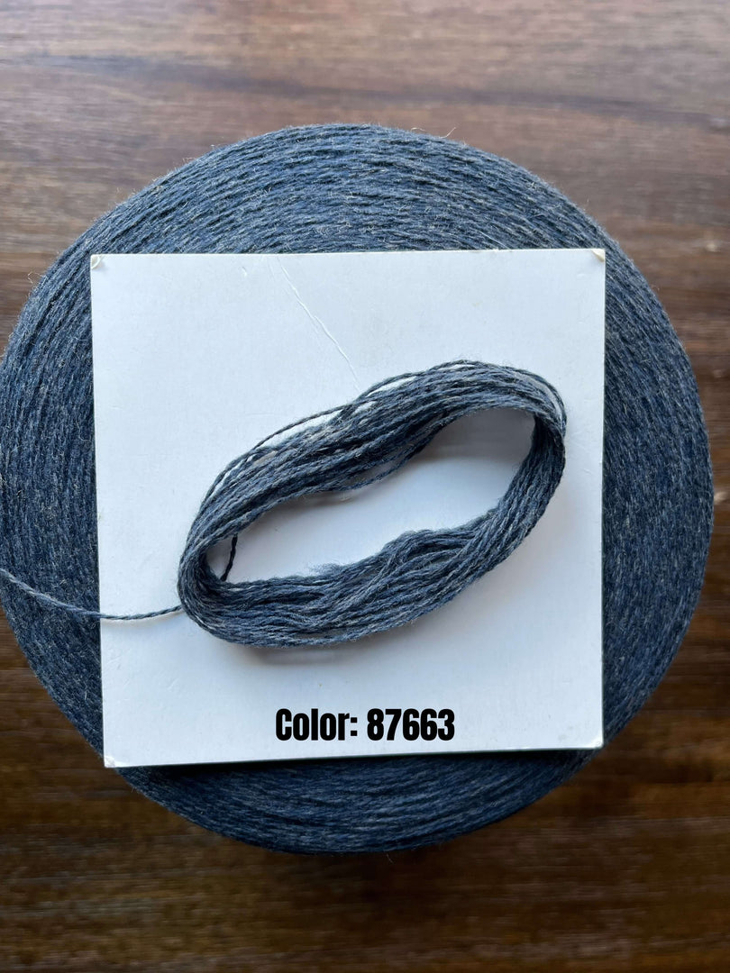 UPW 100 Extrafine Merino Wool cone in color 87663, showcasing high-quality yarn for outerwear and patterns.